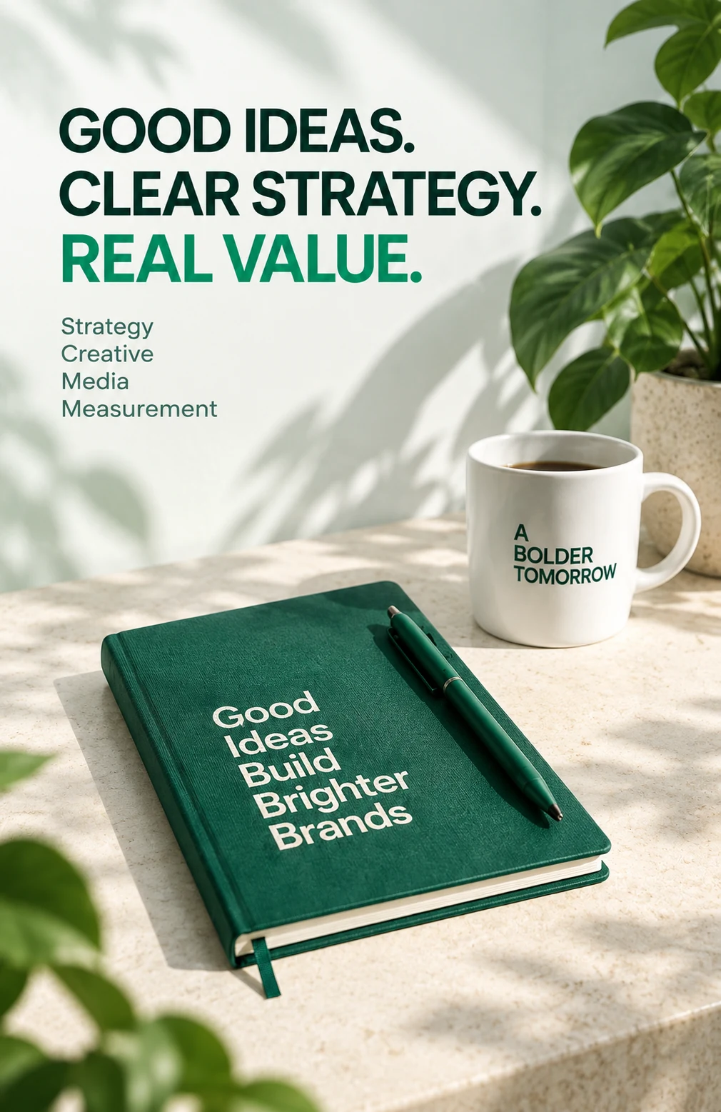 Brand communication concept: a green notebook, pen and mug in natural sunlight